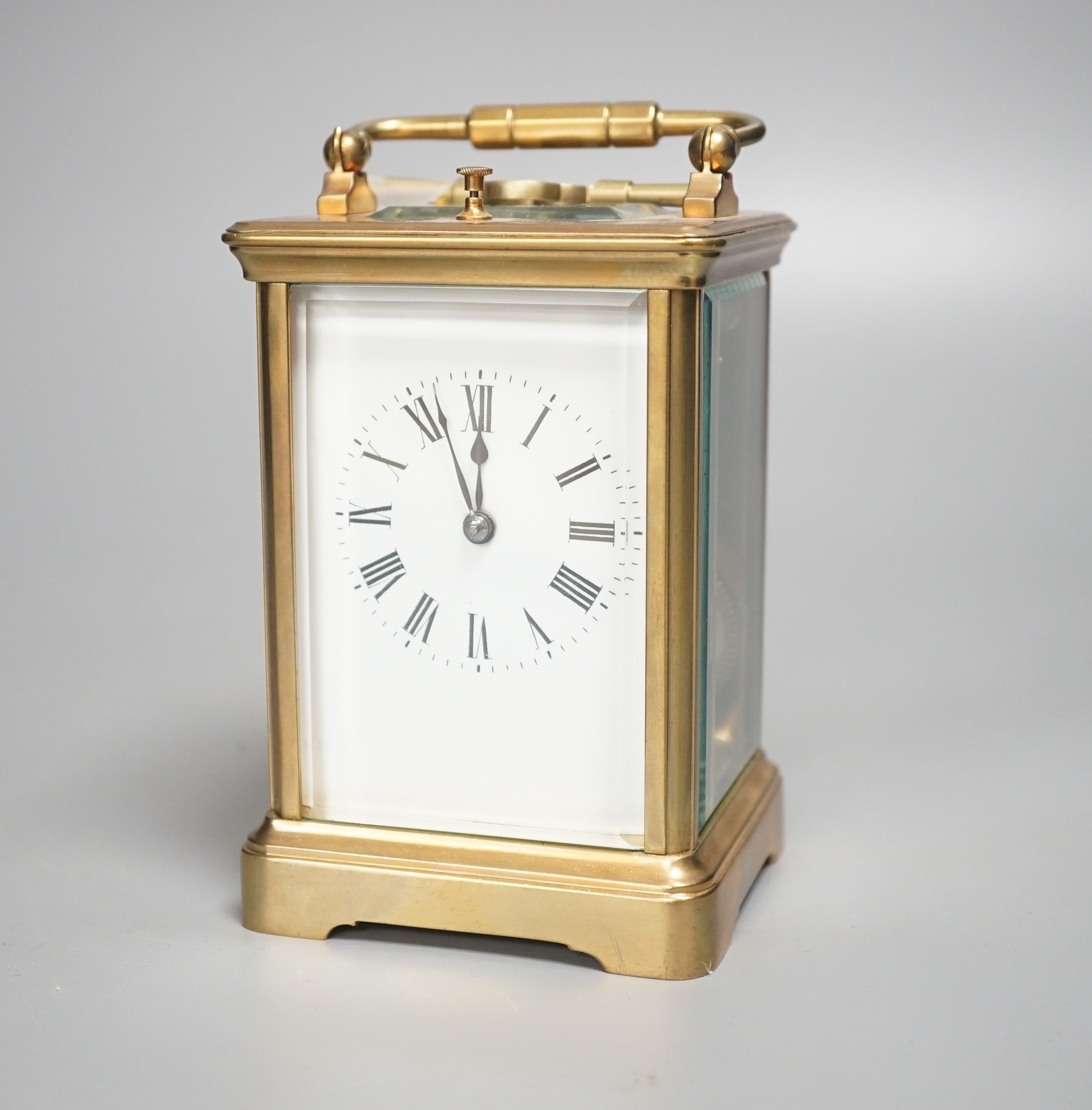 A brass repeating carriage clock, 13cm with key